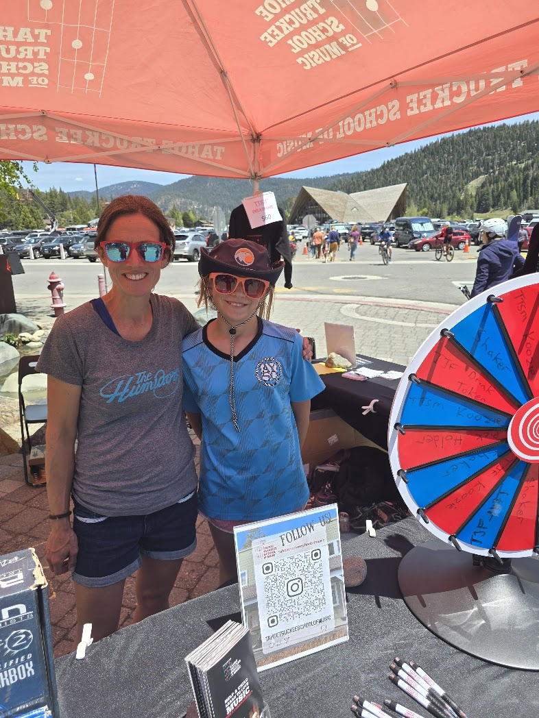 Volunteers at TTSM outreach booth at community event